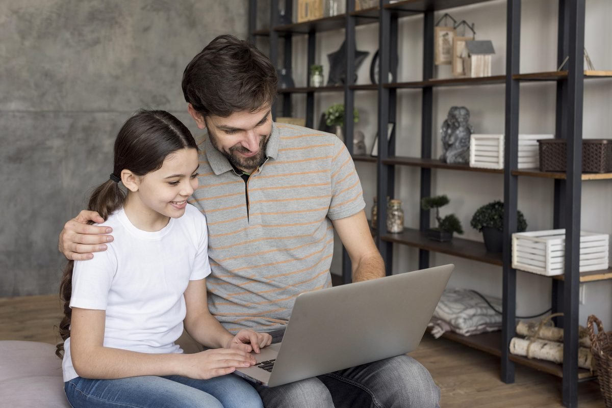 A parent and tutor reviewing homework together