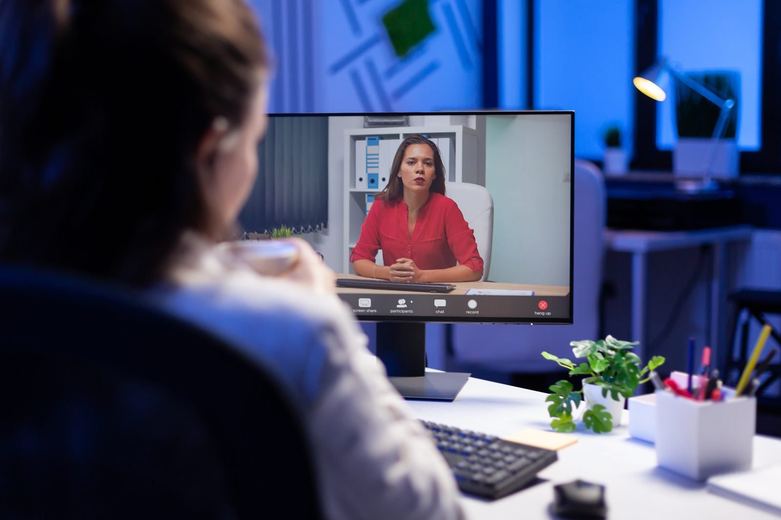 A tutor greeting a student for a video call
