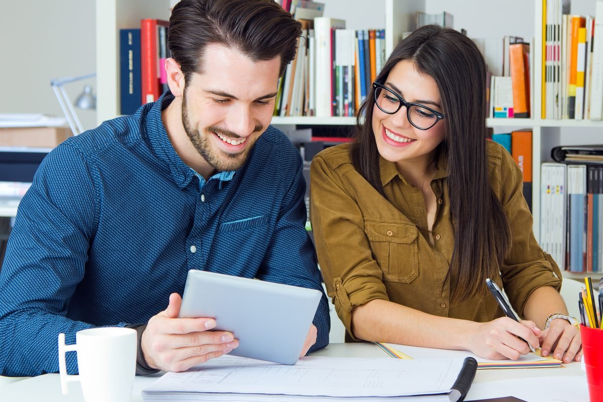 A parent browsing tutor profiles on a laptop
